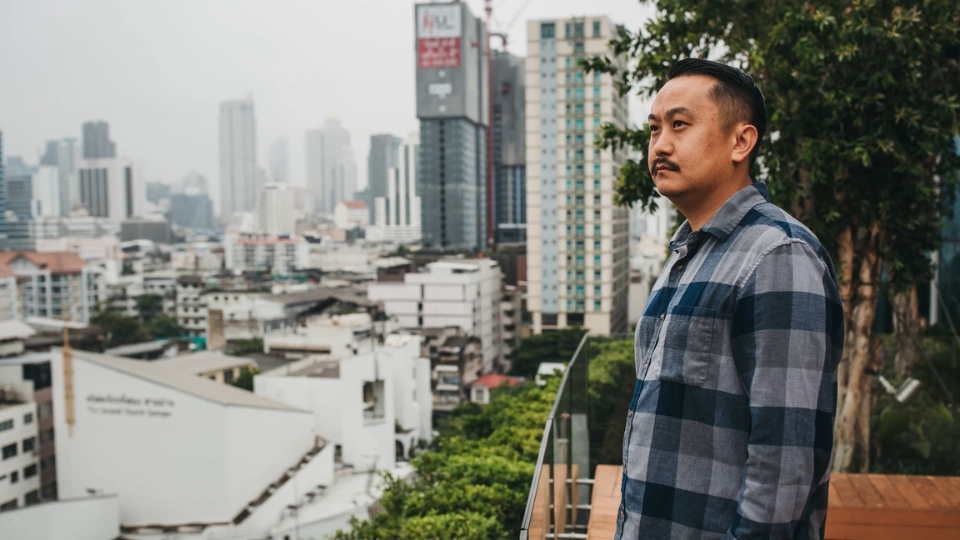 man looking out over a city