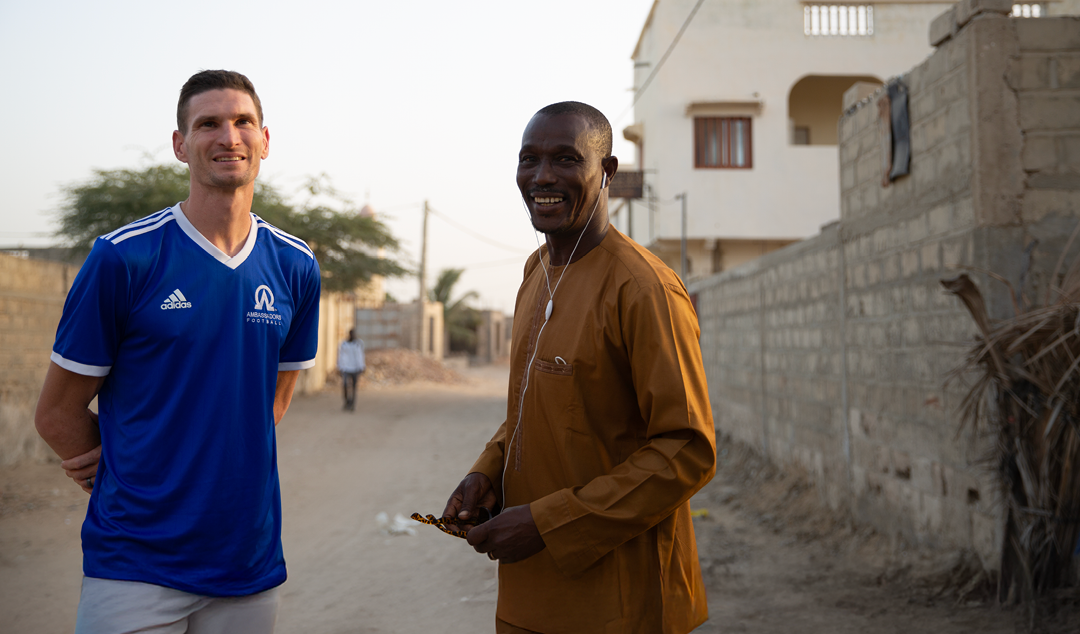 two men smiling together