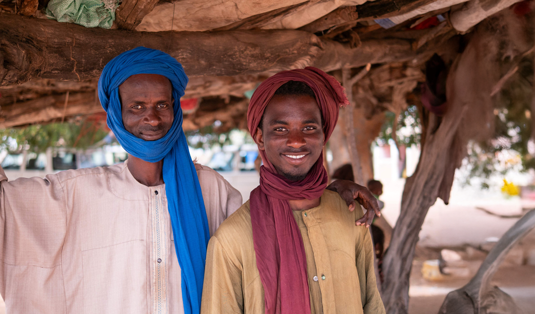 two men smiling together