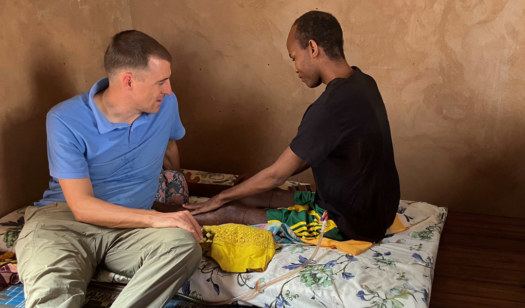man providing medical care to another man