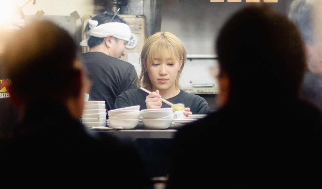 woman behind a food counter