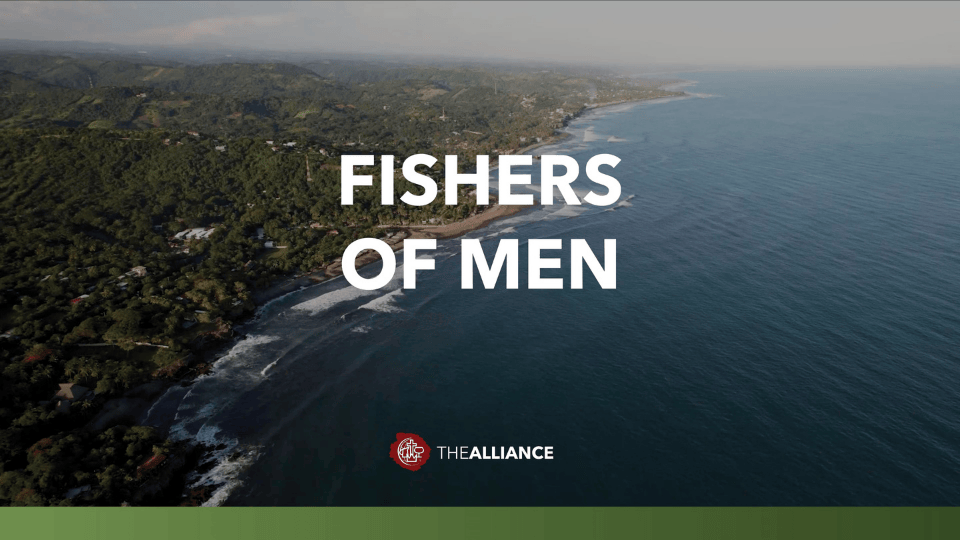 Aerial view of a coastline where forested hills meet the ocean, with the words ‘Fishers of Men’ centered over the image and The Alliance logo displayed near the bottom.