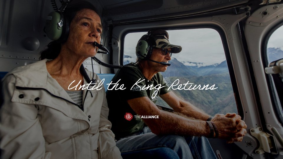 a missionary couple flying in a helicopter